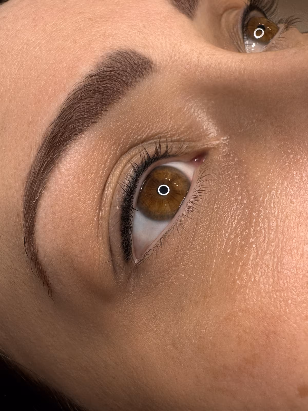 Powder brow and lashline enhancement permanent makeup result, closeup