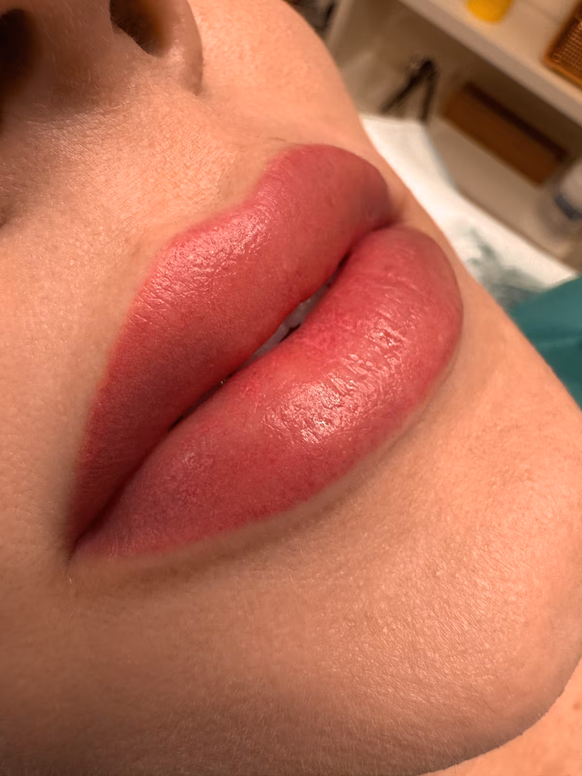 Lip blush result, bright pink closeup